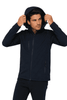 A man wearing a navy soft shell jacket with a hood, featuring zippered pockets and a fitted design.