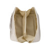 A cream-coloured toiletry bag with a spacious interior featuring multiple compartments and a zippered section.