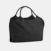 A black nylon shopper bag with two handles and a spacious, unstructured design. It features a logo on the surface.