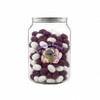 A clear jar filled with purple and white jelly beans, featuring a logo on the front.