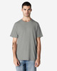 A light grey Gildan cotton t-shirt displayed on a model, featuring a simple design and short sleeves.