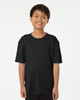 A black performance polo shirt on a young boy, featuring short sleeves and a relaxed fit. It has a small logo on it.