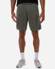 Men's athletic shorts in a muted green colour, featuring an elastic waistband and a logo on the side.