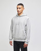 A grey hooded sweatshirt with a front pocket and drawstring hood, featuring a logo on the cuff.