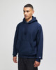 A navy hooded sweatshirt with a front pocket and a logo on the sleeve.