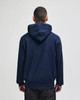 A navy blue pullover hooded sweatshirt with a logo on the back, featuring a relaxed fitting design.