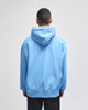 A light blue pullover hooded sweatshirt with a hood and a relaxed fit, featuring a logo on the back.