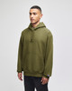 A green hooded sweatshirt with a front pocket and a logo on the sleeve, worn by a model standing against a plain background.