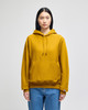 A mustard yellow pullover hooded sweatshirt with a front pocket and a logo on the sleeve.