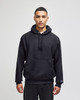 A black pullover hooded sweatshirt with a front pocket and a logo on the sleeve.