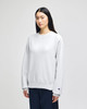 A light grey adult crew sweatshirt with a relaxed fit, featuring a logo on the sleeve.