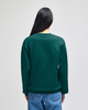 A green crewneck sweatshirt with a relaxed fit, viewed from the back, featuring long sleeves and a simple design.