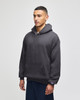A charcoal grey hooded sweatshirt featuring a front pocket and a logo on the sleeve, designed for adults.