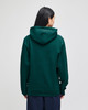 A green pullover hooded sweatshirt with a spacious hood, shown from the back. Features a logo on the garment.