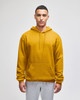 A mustard yellow pullover hooded sweatshirt with a front pocket and a logo on the sleeve.