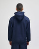 A navy blue pullover hooded sweatshirt viewed from the back, featuring a hood and loose fit.