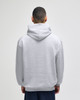A grey pullover hooded sweatshirt with a relaxed fit, featuring a large hood and long sleeves, viewed from the back.