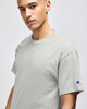 A grey Champion adult short-sleeve t-shirt with a logo on the sleeve.