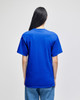 A blue Champion adult short-sleeve T-shirt viewed from the back, featuring a branded logo.