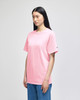 A pink Champion adult short-sleeve T-shirt, displayed on a model standing in profile.