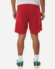 Red men's performance shorts with a loose fit, featuring a logo on the waistband and worn with colourful athletic shoes.