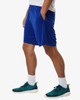 Men's performance shorts in bright blue, featuring pockets and an elastic waistband, paired with green and black trainers.