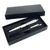 A black gift box containing a black metal pen and a white metal pen, both resting on a foam insert.
