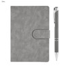 A grey notebook with a clasp and a matching pen, both featured in a sleek gift set.