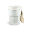 A double wall coffee cup in white with a removable strap. Features a secure lid and a modern design.