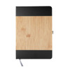 A notebook with a bamboo cover and black accents, featuring a ribbon bookmark and a logo.