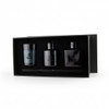 Aroma diffuser and candle gift box featuring a blue candle and two black diffuser bottles, all in a sleek black box with branding.