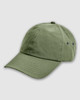 A green washed baseball cap featuring a logo and ventilation eyelets on the sides.