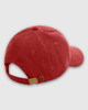 A red dad cap with a brass buckle and an adjustable strap at the back. It features a logo on the side.
