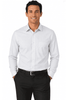 A long-sleeve men's shirt in white, featuring a chest pocket and a logo, worn by a man with hands in pockets.