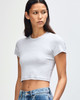 A grey cropped fitted t-shirt with short sleeves and a round neckline, displayed on a model.