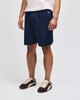Navy cotton gym shorts displayed on a model, featuring an elastic waistband and a logo.