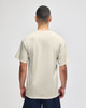 A lightweight adult jersey short sleeve T-shirt in a neutral beige colour, featuring a logo.