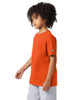 An orange short sleeve t-shirt for youth with a logo on the sleeve, featuring a relaxed fit.