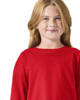 A red long sleeve t-shirt featuring a logo, worn by a child with blonde hair.