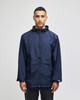 A navy full-zip anorak jacket with a hood, featuring a front pocket and branding on the sleeve.