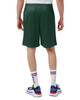 Green mesh shorts with pockets, featuring a logo, view from the back. Styled with white socks and sneakers.