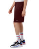 Maroon mesh shorts with pockets, featuring a logo, displayed on a person wearing sporty shoes and socks.
