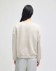 A women's crewneck sweatshirt in light grey, featuring a relaxed fit and simple design on the back.