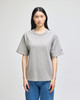 A grey Champion Adult Heritage Jersey T-Shirt on a model, featuring a relaxed fit and short sleeves.