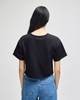 A black cropped short sleeve T-shirt with a plain back, paired with blue denim jeans.