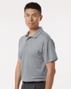 A men's polo shirt in grey featuring a collared neck and short sleeves, with a logo on the chest.