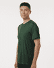 A man wearing a green performance t-shirt, featuring a fitted design and short sleeves. The shirt has a logo.
