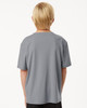 A grey youth t-shirt featuring a simple design and a logo on the back.