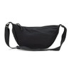 A black crossbody bag with a curved shape, featuring a zip closure and adjustable strap. It has a simple design with a logo.