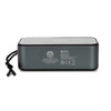 A grey Bluetooth speaker with a mesh top and a side strap, featuring branding and various technical labels on the back.